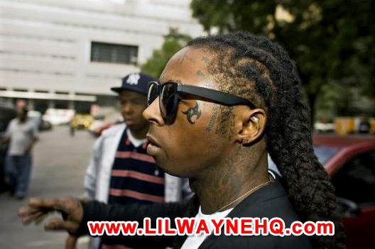 Lil Wayne Face Tattoo He has replaced his tear drop with a tribal symbol.